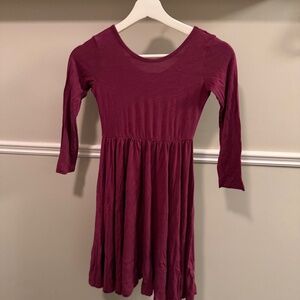Kyte Baby long sleeve bamboo twirl dress in a rich burgundy/wine color. Size 7Y